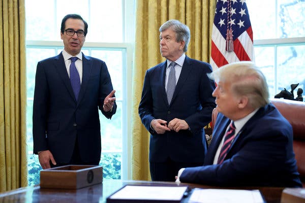 President Trump and Treasury Secretary Steven Mnuchin during a signing ceremony for the Paycheck Protection Program in April.