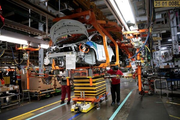 General Motors workers on an assembly line in Lake Orion, Mich., in 2018.